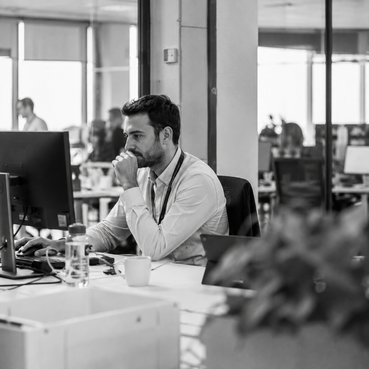 Man at an office looking at his computer
